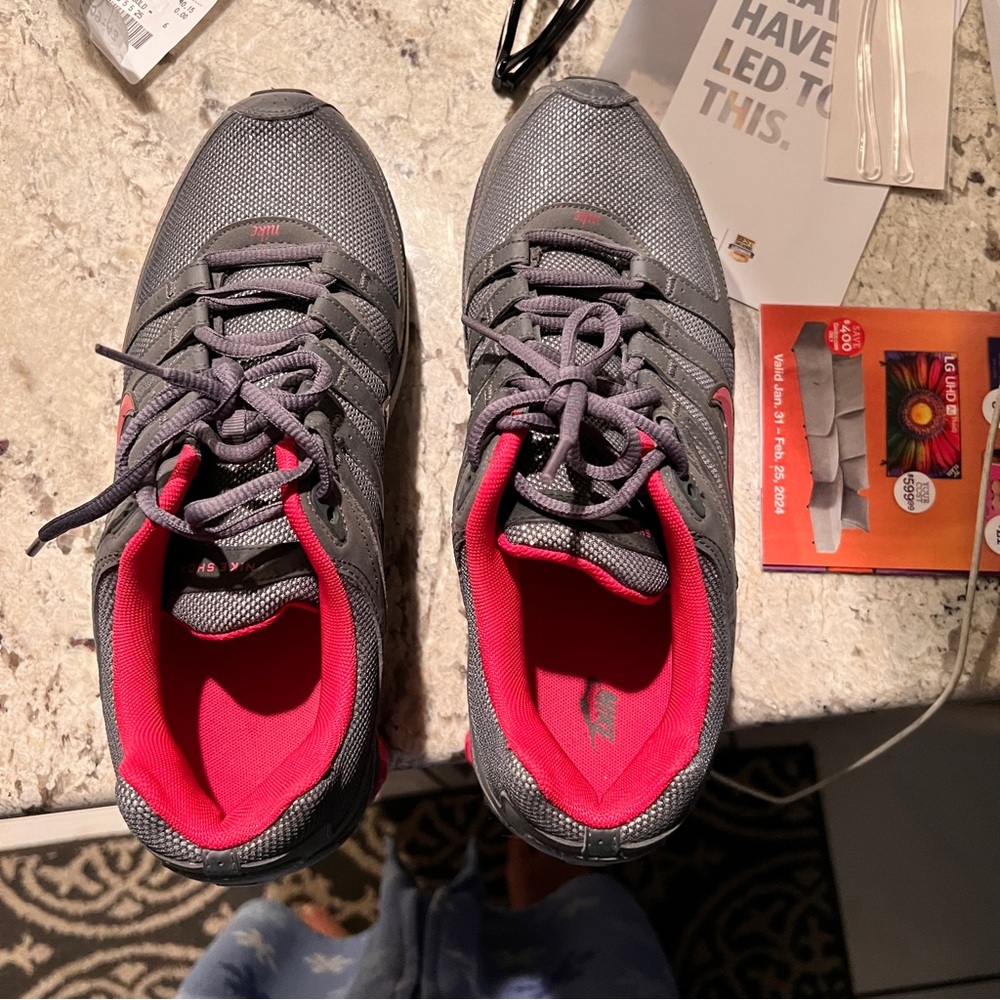 Nike athletic shoe. Gray and pink
